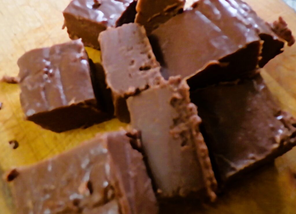 Close-up of chocolate fudge squares with smooth texture.